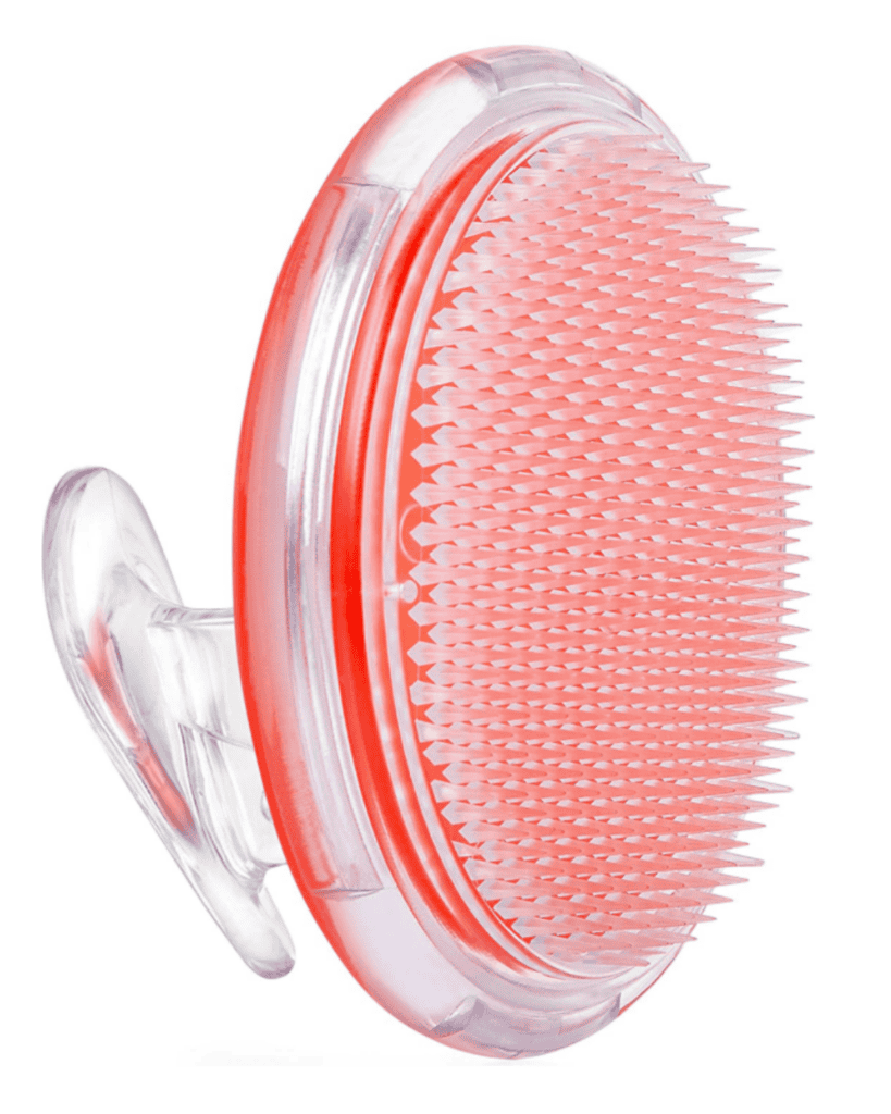 This beauty essential is a red and transparent silicone exfoliating brush with a curved handle. Its short, densely packed bristles are designed for gentle scrubbing, making it perfect for your skincare routine.