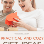 A woman excitedly opens a heart-shaped gift box filled with cool baking gadgets, while a man smiles beside her. The image features the text "The Bargain Sisters: Practical and Cozy Gift Ideas for Her" below.