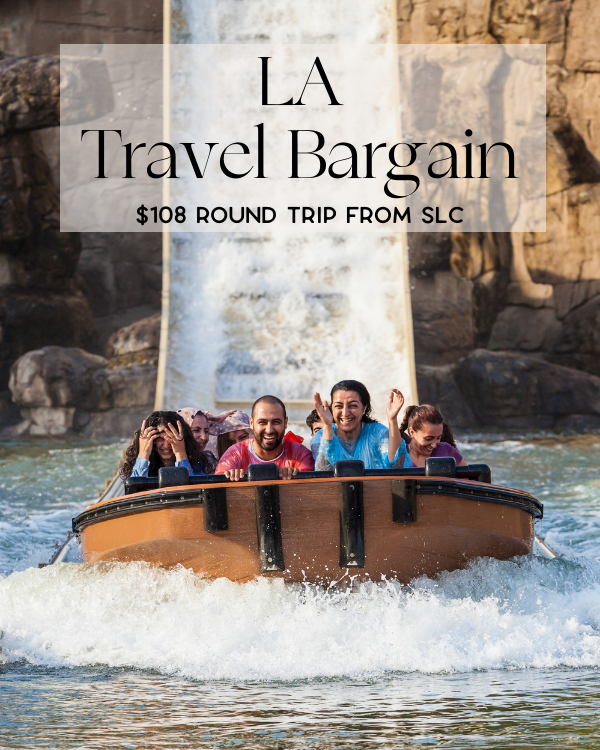 A group of five people, smiling and laughing, ride a log flume water ride in front of a waterfall. The text on the image says, "Los Angeles Travel Bargain $108 Round Trip from SLC" in black font on a translucent white background at the top.