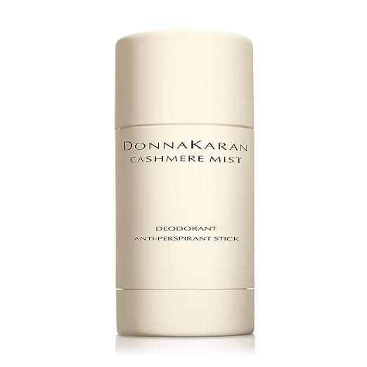 A cream-colored deodorant stick labeled "Donna Karan Cashmere Mist Deodorant Anti-Perspirant Stick." The design is minimalist with black text on a neutral background. Don't miss out on Tuesday Deals for this touch of luxury in your daily routine.