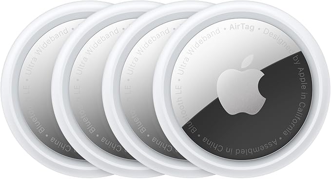 A stack of four Apple AirTags is displayed, each with a circular design featuring a white outer ring and metallic center with the Apple logo. The edge reads "Ultra Wideband" and "Bluetooth LE." Perfect for any Thursday Deals hunt.