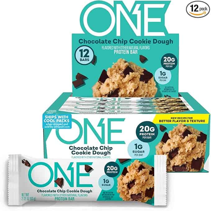 Box of ONE Chocolate Chip Cookie Dough protein bars, perfect for Tuesday Deals. The box and a single bar showcase tempting images of chocolate chip cookie dough. With 12 bars, each offering 20g protein and just 1g sugar, enjoy improved flavor and texture in every bite.