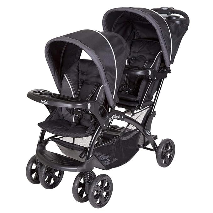 This black double stroller, perfect for Thursday Deals, has two seats with canopies, a handy front tray and cup holder, a spacious storage basket below, and four sets of wheels ensuring stability and smooth movement.