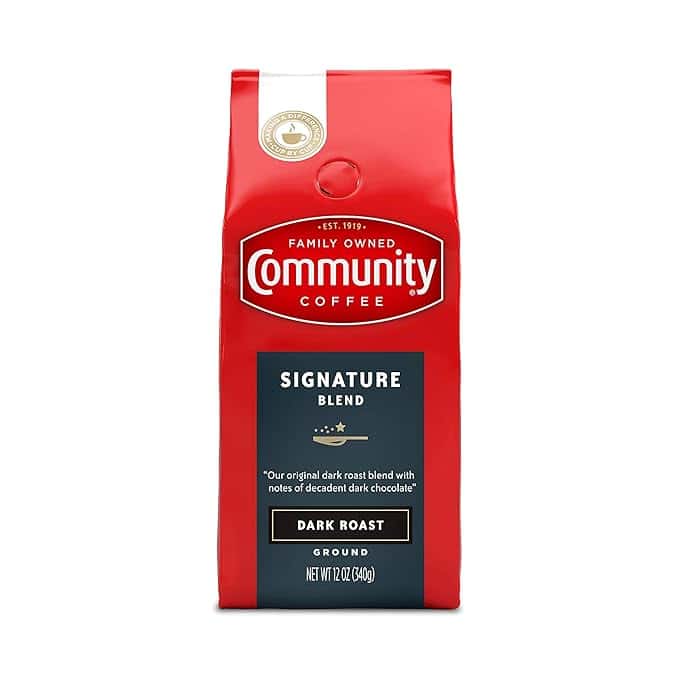 A red package of Community Coffee, labeled "Family Owned" with "Signature Blend Dark Roast," might just be your go-to for Monday Deals. The bag highlights its original dark roast blend with notes of dark chocolate and contains 12 oz (340g) of ground coffee.