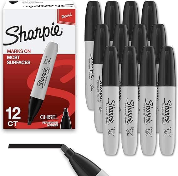 A box of Sharpie chisel-tip permanent markers is displayed, labeled "12 CT Broad." Eleven markers are arranged upright beside the box. A close-up of the chisel tip is shown at the bottom. Don't miss out on these Wednesday Deals for vibrant creativity every day!