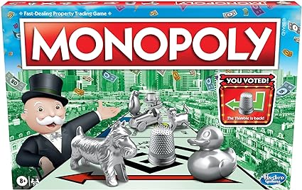 Monopoly board game box with the iconic logo, Mr. Monopoly, and silver tokens like a top hat, dog, duck, and thimble. "You voted! The thimble is back!" graces the cover amid a cityscape with flying cash—perfect for Wednesday Deals enthusiasts looking to snag this classic at a bargain!