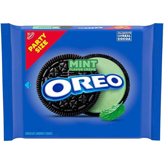 Image of a blue "Party Size" Oreo cookies package with mint flavor creme, tempting with Tuesday Deals. The package showcases two Oreo cookies, one open to reveal vibrant green mint filling, alongside a mint leaf graphic.