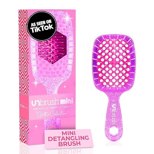 A sparkly pink mini detangling brush sits beside its matching packaging, part of the "Glitter Collection." With a label boasting its popularity on TikTok, this shimmering gem is perfect for Wednesday Deals.