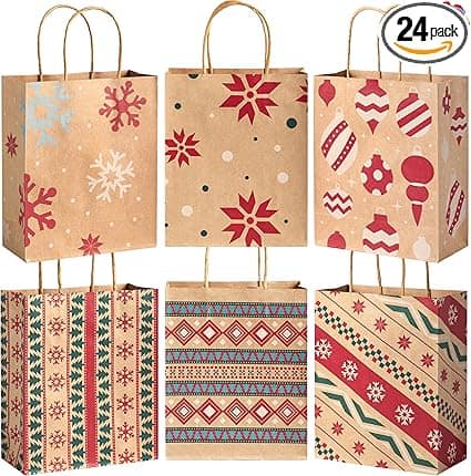 A set of six festive gift bags with handles, featuring holiday designs like snowflakes, abstract shapes, ornaments, and geometric patterns in red, green, and white on brown paper. Perfect for Wednesday Deals shoppers, a "24 pack" label is visible in the top corner.