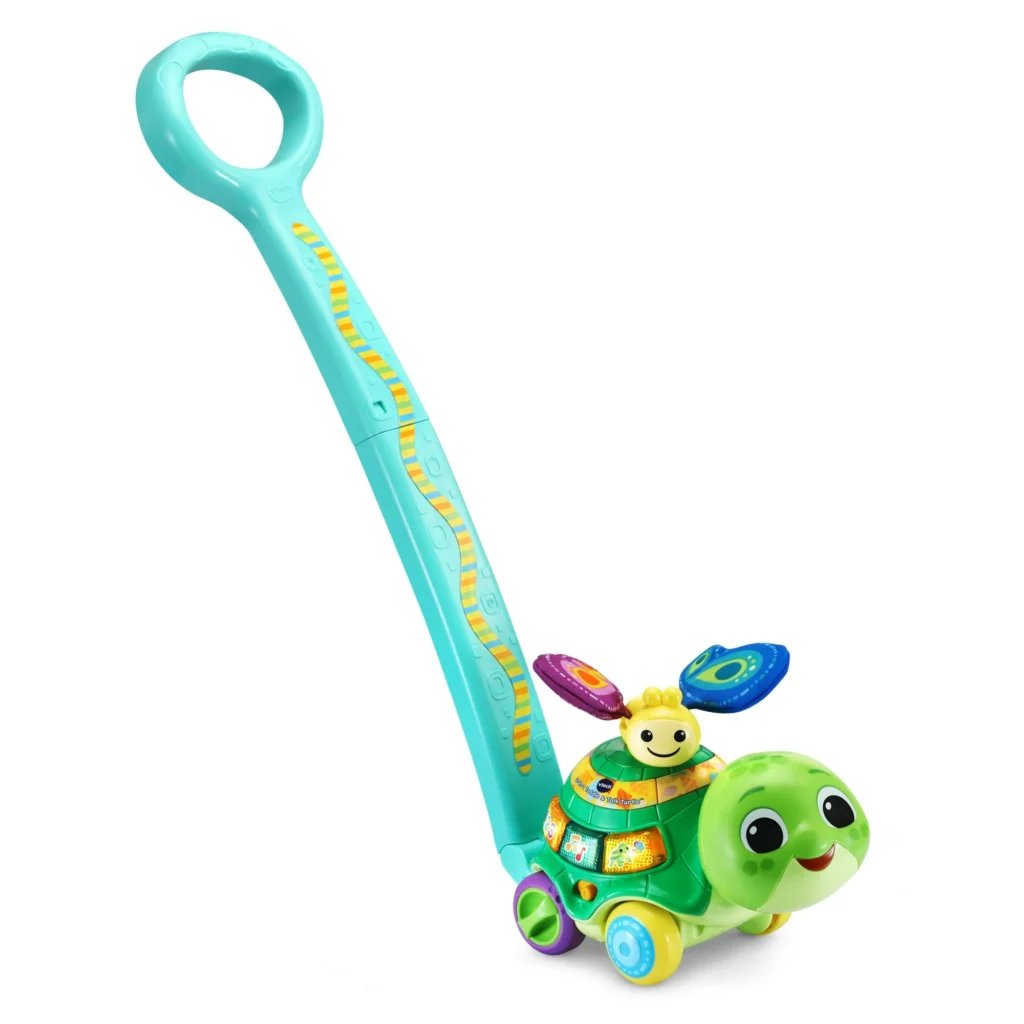 This colorful children's push toy, perfect for Thursday Deals, features a smiling green turtle with a long handle. The turtle carries a smaller character on its back with two spinning flowers. The blue handle is adorned with yellow patterns, making it an eye-catching delight for little ones.