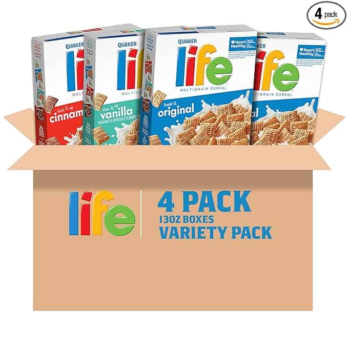 A cardboard box featuring four packs of Quaker Life Multigrain Cereal in diverse flavors: Vanilla, Cinnamon, and Original. Perfect for Monday Deals, the box proudly displays "4 pack, 13 oz boxes, Variety Pack," offering a delicious start to your week with wholesome variety.