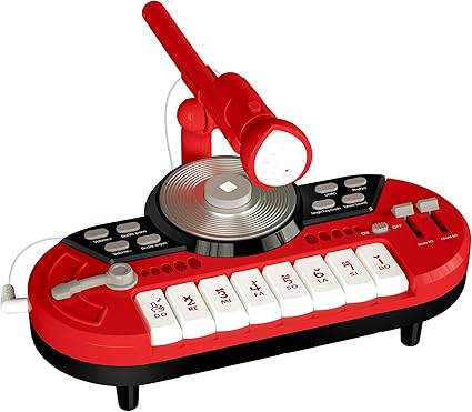 This red and black toy DJ mixer, perfect for Friday Deals shopping, features a microphone, central turntable, and a row of white keys adorned with music notes and symbols. It also boasts multiple buttons for sound effects and volume control.