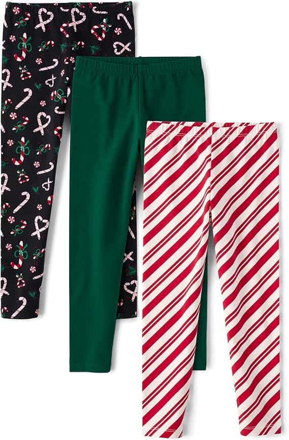 Three pairs of holiday-themed leggings are showcased in a Friday Deals special. One pair is black with candy cane and bow patterns, another is solid green, and the last features red and white diagonal stripes.