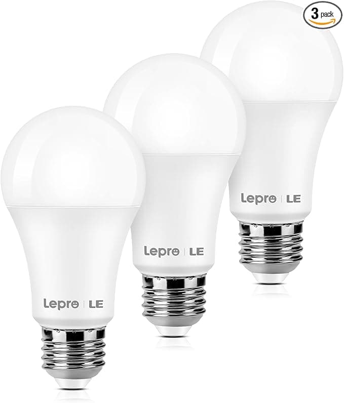 Three Lepro LED light bulbs are showcased in a staggered line, each gleaming white with a silver screw base. The packaging reveals it's a convenient 3-pack, perfect for those savvy Monday Deals enthusiasts.