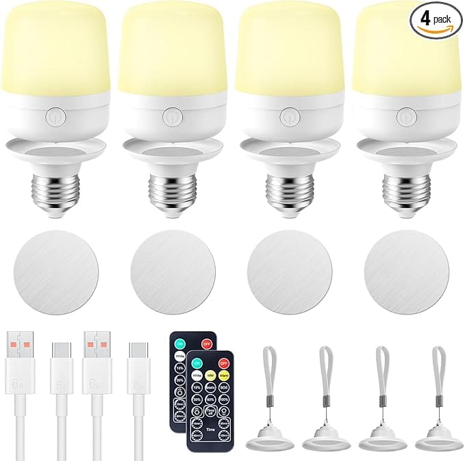 Discover Tuesday Deals on a set of four LED light bulbs with yellow tops, complete with bases, USB cables, remote controls, and suction cup hooks. The image highlights the "4 pack" label at the top right, offering you bright savings and convenience in one package.