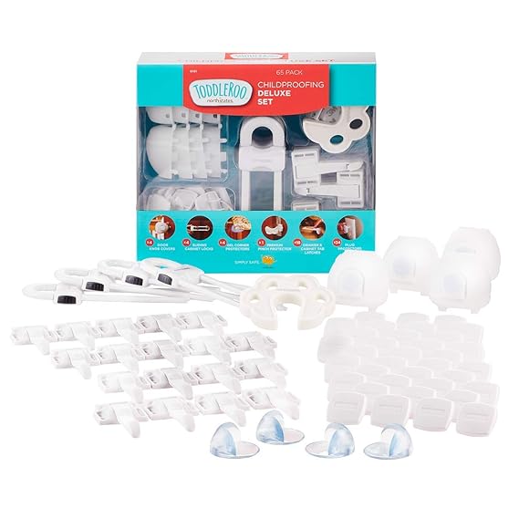 A childproofing set with cabinet locks, outlet covers, corner protectors, and door stoppers is displayed against a white background. The packaging reads "Toddleroo Childproofing Deluxe Set" and showcases the product pieces clearly. Grab these essentials during our Thursday Deals!.