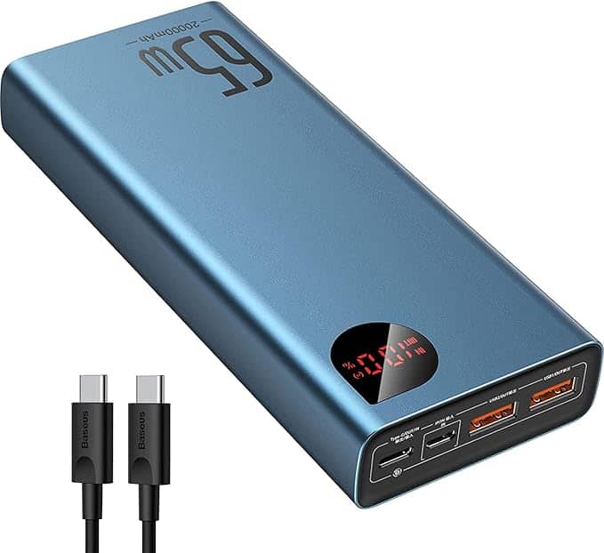 A blue portable charger with a digital display shows "65W" and charge percentage. It features multiple charging ports, including USB-C and USB-A. A USB-C cable is shown next to it, making it a smart grab for Tuesday Deals enthusiasts seeking power on the go.