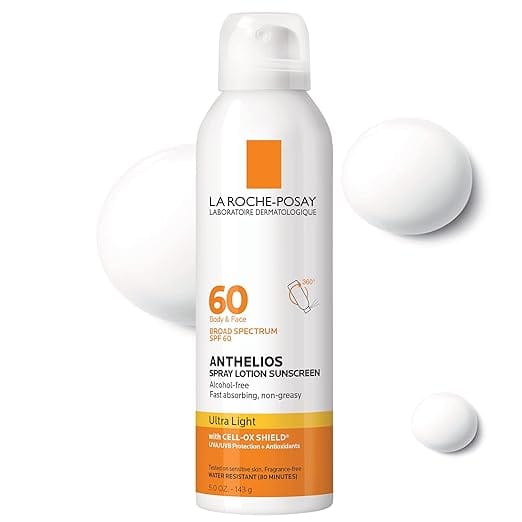 Image of a white cylindrical bottle of La Roche-Posay Anthelios spray lotion sunscreen with SPF 60, ideal for Tuesday Deals. The labeling highlights "Ultra Light," "FAST Absorbing," and "Non-Greasy." It rests against a light background adorned with blobs of lotion.