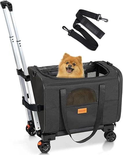 A small brown dog sits happily inside a black rolling pet carrier, perfect for Thursday Deals. The carrier features mesh windows and pockets, with an adjustable shoulder strap displayed above the bag.