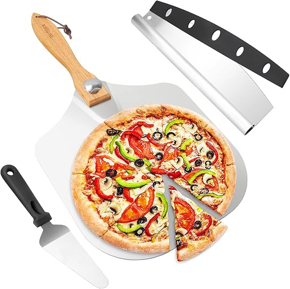 A fresh pizza with tomato, green pepper, mushrooms, and black olives is sliced on a wooden-handled pizza peel. Nearby are a pizza cutter and dough scraper with black handles. Get ready for deliciousness with our Tuesday Deals on this perfect slice!.