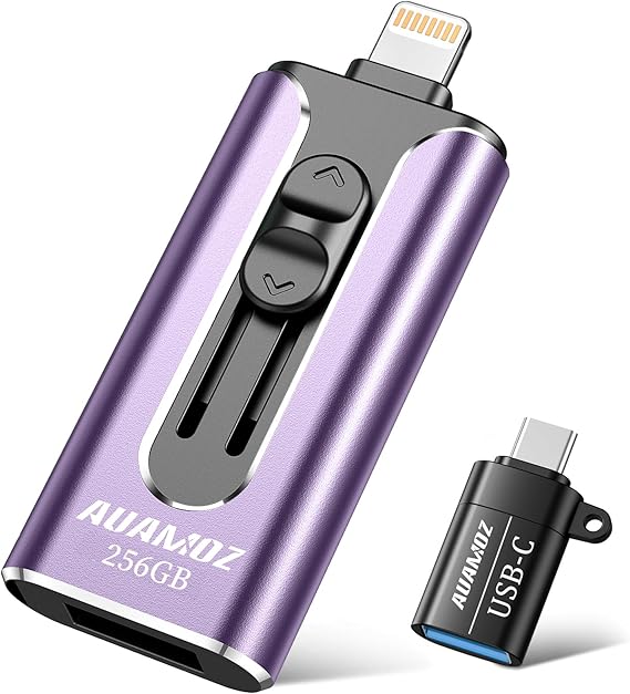 A purple and black 256GB flash drive with dual connectors for Lightning and USB, featuring a sliding mechanism, is displayed next to a separate USB-C adapter. Perfect for tech enthusiasts, grab yours during our exclusive Friday Deals for amazing savings!.