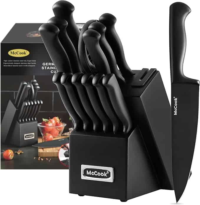 Discover the McCook black knife block set, featuring several knives with ergonomic handles. Perfect for all your Tuesday Deals shopping, the brand name is elegantly displayed on both the block and blades, presented before its packaging box with a matching image.