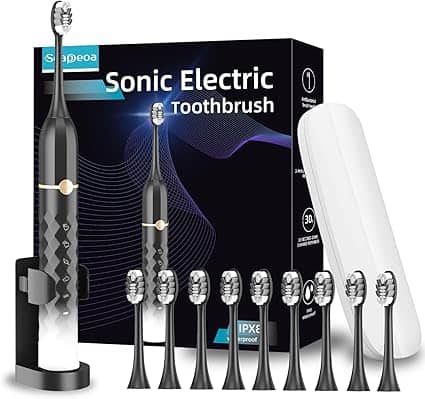 A black and white sonic electric toothbrush set, part of our exclusive Thursday Deals, includes a toothbrush, charging stand, travel case, and eight replacement heads. The packaging in the background features a modern design with blue and purple wave graphics.