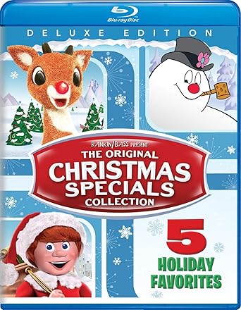 Blu-ray cover titled "The Original Christmas Specials Collection Deluxe Edition" featuring Rudolph the Red-Nosed Reindeer, Frosty the Snowman, and Santa Claus. Text reads "5 Holiday Favorites." Capture some Wednesday Deals magic with snowy scenes and festive characters shown.