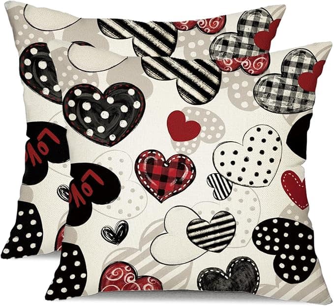 These delightful decorative pillows, perfect for adding charm to any space, feature a vibrant array of heart designs in black, red, and white. With patterns like stripes, polka dots, and plaid—and the word "love" adorning one heart—these are must-haves in this week's Friday Deals.