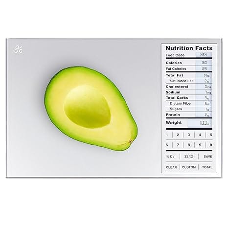 An avocado half sits on a digital kitchen scale, showcasing nutritional facts like calories, fat, and protein. The white, minimalistic background highlights every detail. A perfect morning choice for those mindful of their diet—even better when avocados feature in Tuesday Deals!.