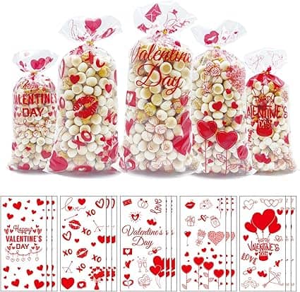 Five Valentine's Day-themed bags filled with various candies are lined up, showcasing their red and white patterns adorned with hearts and "Valentine's Day" phrases. Take advantage of our exclusive Friday Deals to sweeten your celebrations even more.