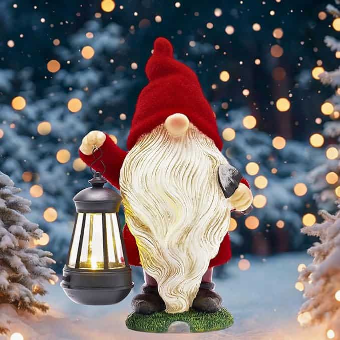 A gnome with a long white beard and red hat holds a glowing lantern in a snowy forest. Twinkling lights illuminate the background, creating a festive atmosphere perfect for Monday Deals delight.