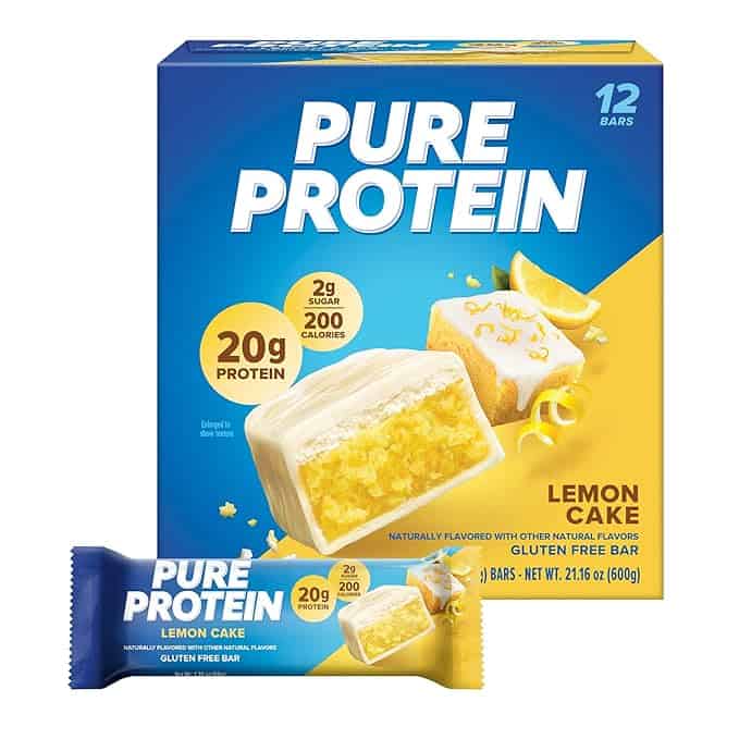 Box of Pure Protein Lemon Cake bars, available in a pack of 12. The packaging spotlights "20g protein," "2g sugar," and "200 calories." A single bar is displayed prominently. Don't miss out on our Friday Deals for this energizing treat!.