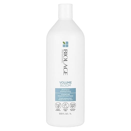 A white 33.8 fl oz (1 liter) bottle of Biolage Volume Bloom shampoo, showcasing branding and text that highlight its paraben-free, vegan, cruelty-free formula with natural ingredients. Perfect for scoring on Wednesday Deals.