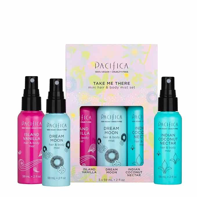 Set of three Pacifica brand mini hair and body mists, featured in this week's Tuesday Deals, displayed in front of their packaging. Scents include Island Vanilla, Dream Moon, and Indian Coconut Nectar. Bottles are vibrant with floral and nature-themed designs.