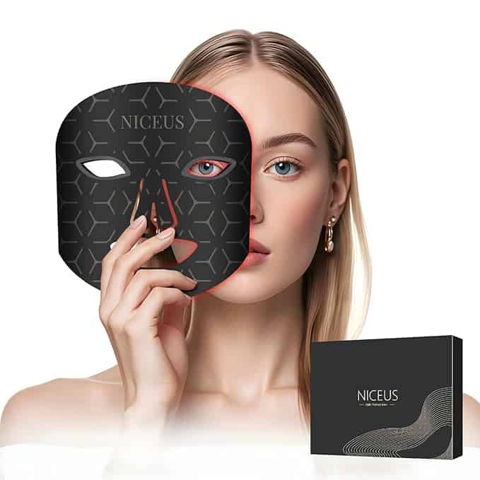 A person holds a patterned mask in front of their face. The mask is black with geometric designs and the word "NICEUS" printed on it. Nearby, a matching box hints at enticing Friday Deals. The person has blonde hair and wears earrings.