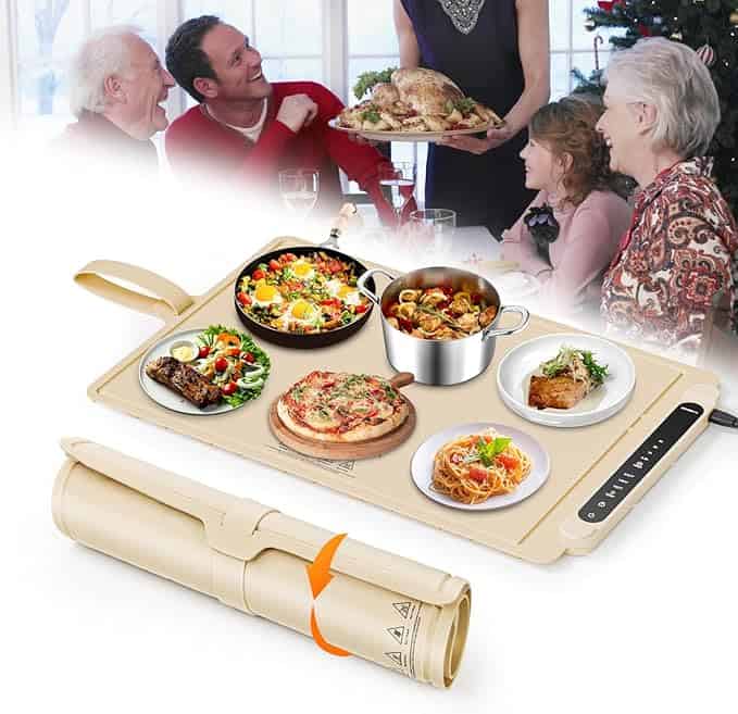 A joyous family gathers at the table, enjoying a hearty meal as a woman serves turkey. In the foreground, a rectangular cooking mat displays dishes like stew, salad, pizza, and fish. A rolled-up mat lies nearby, perfect for storing leftovers from those Tuesday Deals.