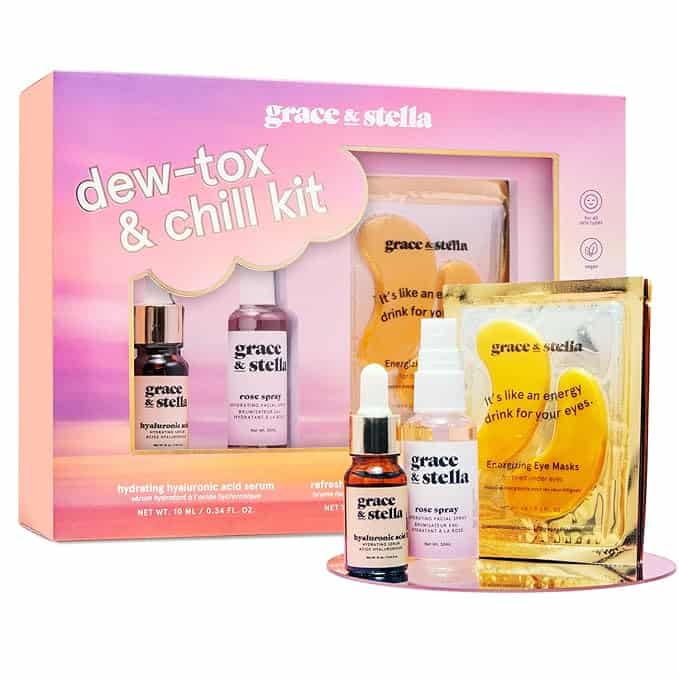 Discover the "dew-tox & chill kit" from Grace & Stella, perfect for Friday Deals. This beauty set includes a hydrating hyaluronic acid serum, rose spray, and energy drink eye masks in vibrant packaging, featuring small bottles and luxurious gold eye masks.