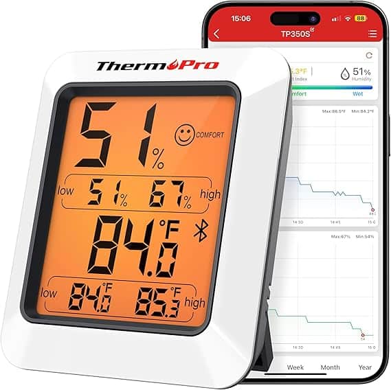 A digital ThermoPro hygrometer shows 51% humidity and 84°F, complete with comfort indicators. In the background, a smartphone screen displays the ThermoPro app graphing past trends. Don't miss out on Thursday Deals to get this perfect combination of precision and convenience at a great price.