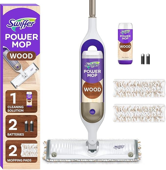 Swiffer Power Mop for wood floors, highlighted amidst its sleek packaging, boasts one cleaning solution, two batteries, and mopping pads. Perfect for tackling dirt on wood surfaces. Grab it now in the special Wednesday Deals to enhance your floor care routine!.