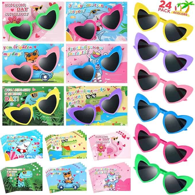 Discover Tuesday Deals on a collection of colorful heart and bow-shaped sunglasses for Valentine's Day. Available in pink, purple, and yellow, each pair comes with decorative cards showcasing animals and cheerful messages. A 24-pack display is featured on the top right.