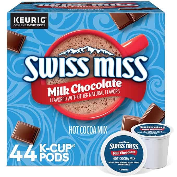 Image of a Swiss Miss Milk Chocolate K-Cup Pods box. The blue box showcases tempting chocolate images and a steaming cup of hot cocoa, boasting "44 K-Cup Pods" and "Hot Cocoa Mix" enhanced with other natural flavors. Perfect for Thursday Deals, a K-Cup pod is displayed in front.