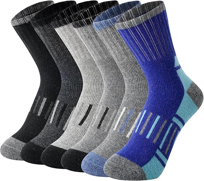 A set of six pairs of crew socks, perfect for Tuesday Deals, is displayed in a row, each with a ribbed texture. Colors range from black and various shades of gray to blue with turquoise accents. Featuring reinforced heel and toe design for durability.