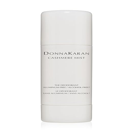 A white cylindrical deodorant stick with "Donna Karan Cashmere Mist" printed on it, perfect for those Wednesday Deals. The label proudly states "The Deodorant" and highlights its aluminum-free and alcohol-free formula.