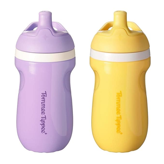 Two Tommee Tippee sippy cups, one purple and one yellow, stand side by side, showcasing their ergonomic design and white spouts. With the brand name printed vertically on the front, these cups are a perfect choice for Tuesday Deals.