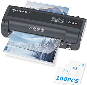 A black Bonsen laminator in action, preserving a winter landscape photo. Perfect for Tuesday Deals, it accommodates three paper sizes (A4, A5, A6) with ease. "100 PCS" indicated on the side highlights its capacity, while multiple control buttons and an On/Off switch ensure user-friendly operation.