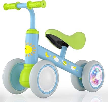 A colorful children's balance bike features a blue frame, green handlebars and seat, and four wheels. It showcases a cheerful sun and clouds design, with one wheel displaying a bright pattern. Perfect for Friday Deals!.