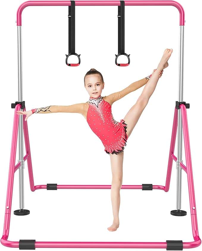 A young gymnast performs a split under a pink gymnastics bar, her sparkly red leotard catching the light. It's a striking scene against the plain white background, reminiscent of those eye-catching Wednesday Deals that shouldn't be missed.