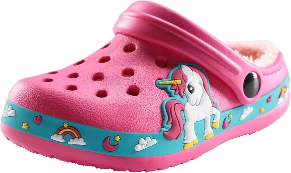 A pink children's clog with fluffy lining, adorned with a unicorn, stars, clouds, and rainbows on the side band. It features a strap and circular ventilation holes. Perfect for Friday Deals shopping sprees!.