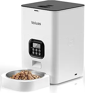 The Voluas automatic pet feeder features a sleek white and black design with a digital control panel. It dispenses dry food into a stainless steel bowl, making meal times effortless. Score big savings by checking out our exclusive Wednesday Deals this week!.